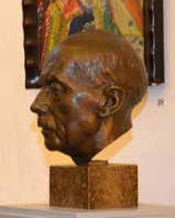 Der Bronzekopf erinnert an den Bildhauer Johann Michael Bossard. Das Gesamtwerk des Künstlerehepaars Bossard befindet sich in der zwischen Jesteburg und Lüllau gelegenen Kunststätte