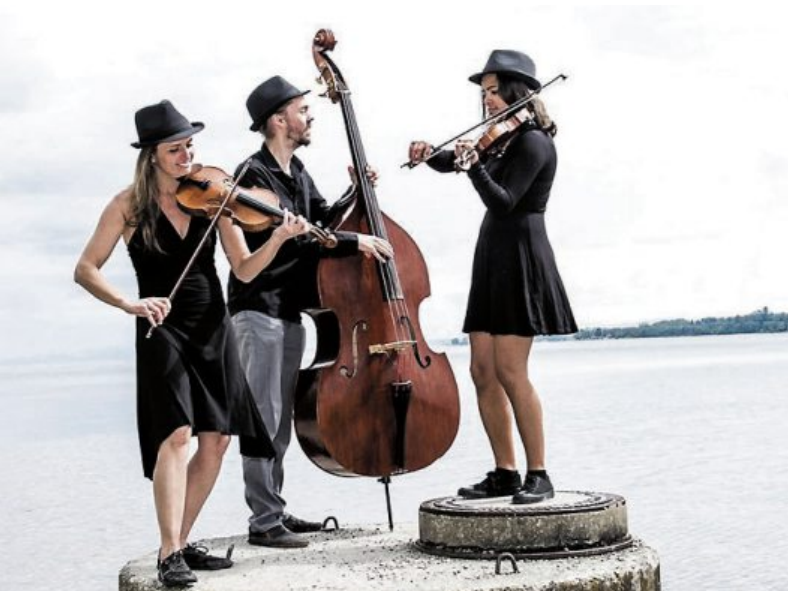 Dot Dot Dot: ein Trio aus zwei Geigen und einem Kontrabass. Irgendwo zwischen Folk, Jazz und Klassik mischt das Trio seine selbstkomponierte Musik zu einer ganz eigenen, verspielten, unkonventionellen Klangwelt. Dot Dot Dot: ein Trio aus zwei Geigen und einem Kontrabass. Irgendwo zwischen Folk, Jazz und Klassik mischt das Trio seine selbstkomponierte Musik zu einer ganz eigenen, verspielten, unkonventionellen Klangwelt.
